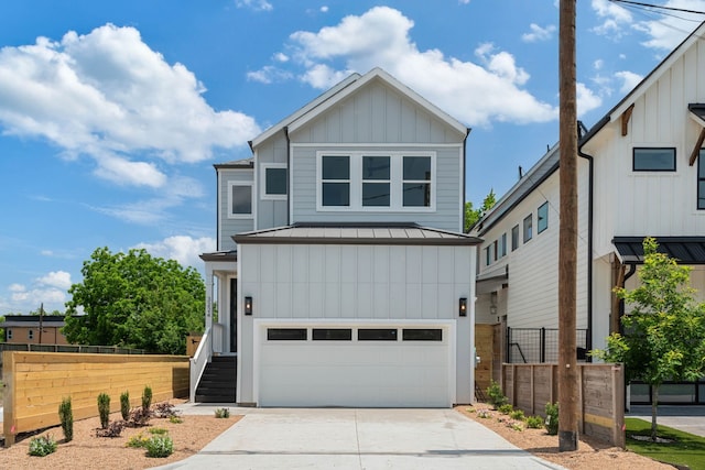 3224 Omega St, Houston, TX 77022 - view of front of home featuring board and batten siding, a garage, a standing seam roof, driveway, and a metal roof
