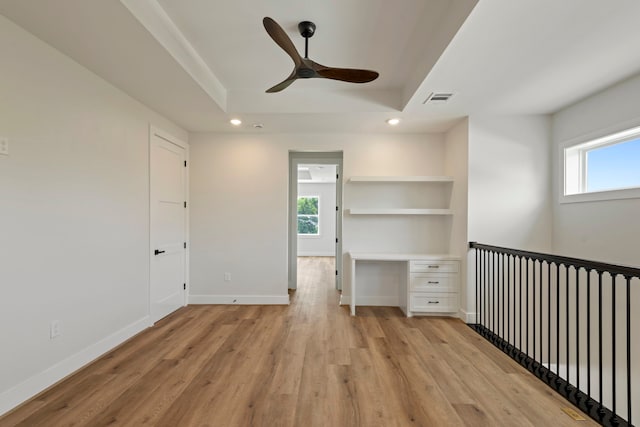 3224 Omega St, Houston, TX 77022 - unfurnished bedroom featuring light wood-style flooring, recessed lighting, a tray ceiling, and a ceiling fan