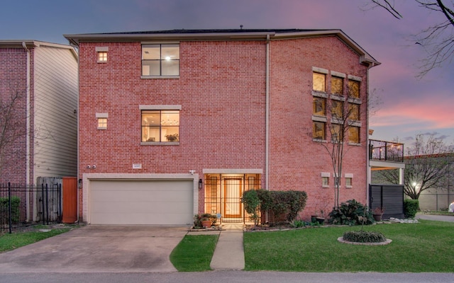 6205 Dell St, Houston, TX 77007 - view of front of home with brick siding, a garage, and driveway