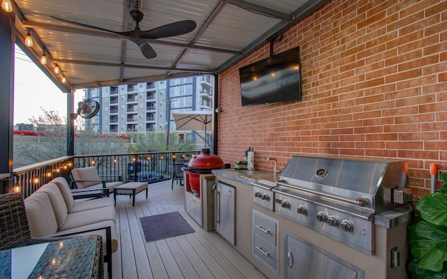 6205 Dell St, Houston, TX 77007 - wooden deck with exterior kitchen, ceiling fan, and an outdoor living space