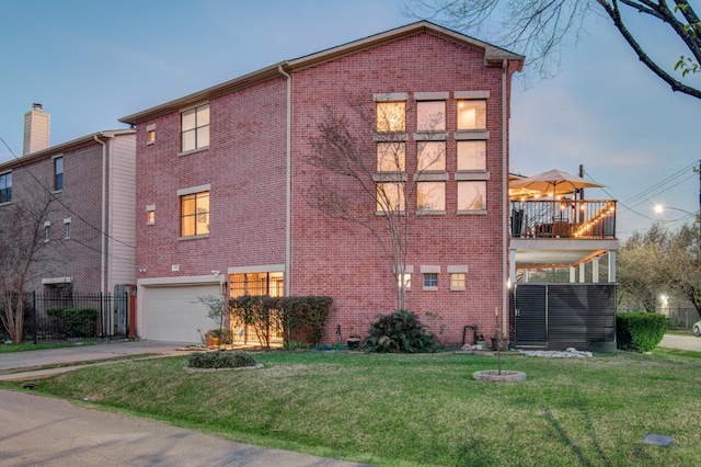 6205 Dell St, Houston, TX 77007 - view of side of home with brick siding, a balcony, driveway, and a garage