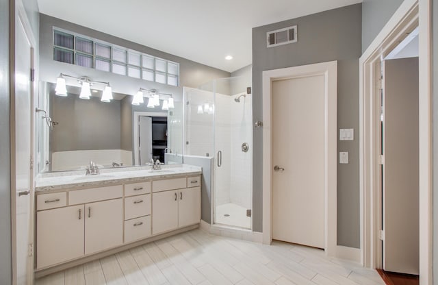 6205 Dell St, Houston, TX 77007 - bathroom featuring a shower stall and double vanity