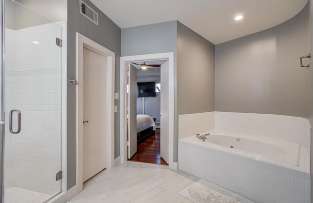 6205 Dell St, Houston, TX 77007 - full bathroom with ensuite bath, a shower stall, a whirlpool tub, and a ceiling fan