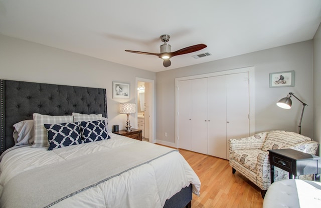 6205 Dell St, Houston, TX 77007 - bedroom with light wood-style flooring, a closet, and a ceiling fan