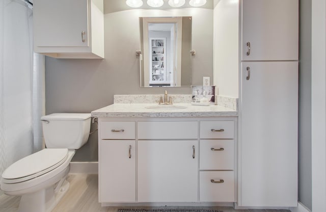 6205 Dell St, Houston, TX 77007 - full bathroom featuring vanity, curtained shower, and wood finished floors