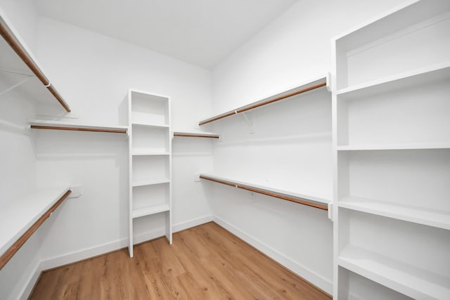 5520 Chapman St, Houston, TX 77009 - walk in closet featuring wood finished floors