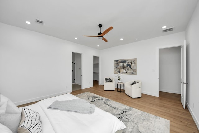 5520 Chapman St, Houston, TX 77009 - bedroom with light wood-type flooring, recessed lighting, a ceiling fan, and a spacious closet