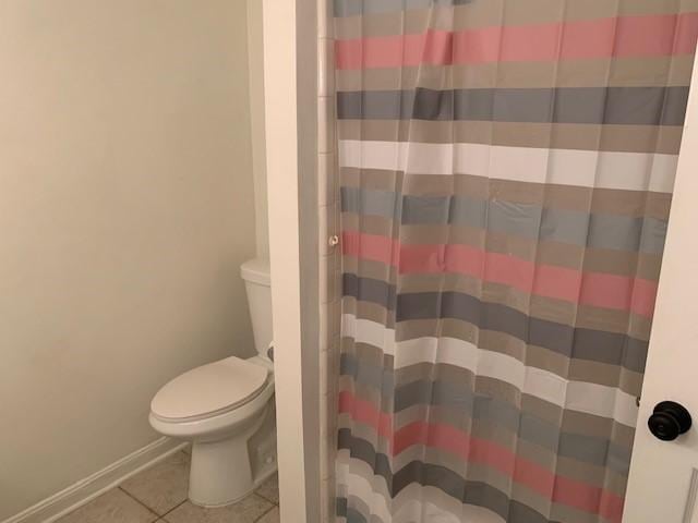 15025 Stagecoach Rd, Stagecoach, TX 77355 - full bath with tile patterned floors and a shower with shower curtain