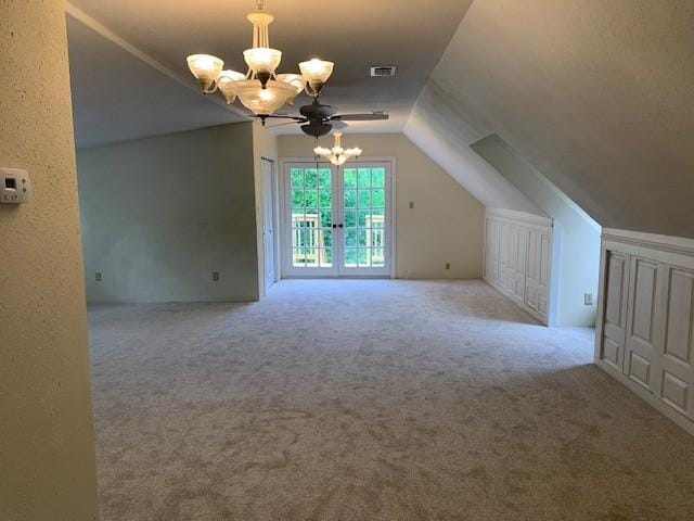 15025 Stagecoach Rd, Stagecoach, TX 77355 - additional living space featuring a chandelier, carpet floors, and vaulted ceiling