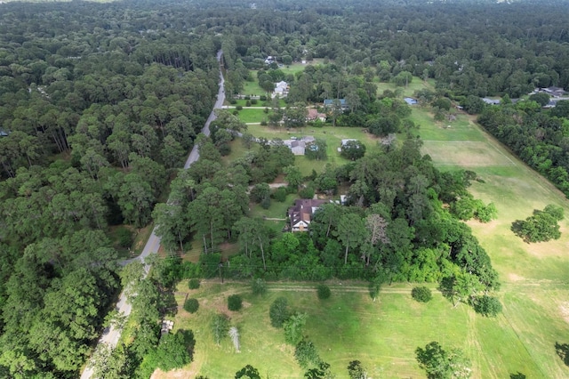 15025 Stagecoach Rd, Stagecoach, TX 77355 - aerial view of property and surrounding area featuring a heavily wooded area and rural landscape