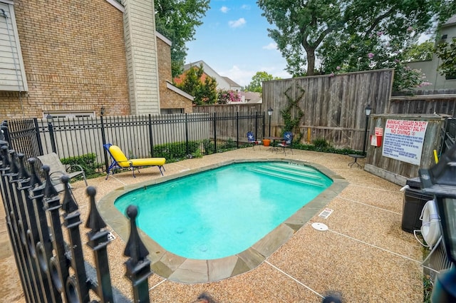 2601 Augusta Dr Unit 26, Houston, TX 77057 - community pool with a fenced backyard