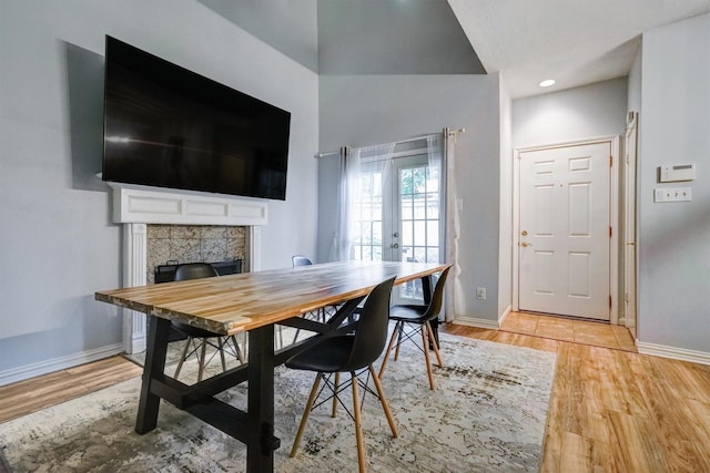 2601 Augusta Dr Unit 26, Houston, TX 77057 - dining space with light wood finished floors and a tile fireplace