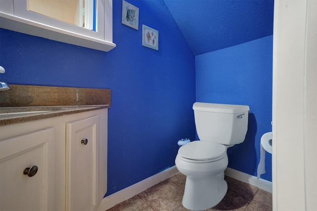 2601 Augusta Dr Unit 26, Houston, TX 77057 - half bath with lofted ceiling, vanity, tile patterned floors, and a textured ceiling