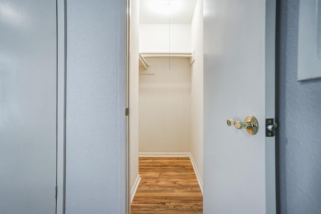 2601 Augusta Dr Unit 26, Houston, TX 77057 - walk in closet with attic access and wood finished floors