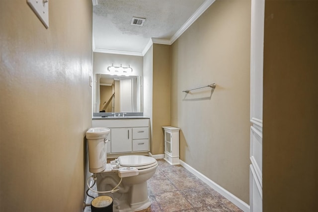 2601 Augusta Dr Unit 26, Houston, TX 77057 - bathroom featuring crown molding, a textured ceiling, and vanity