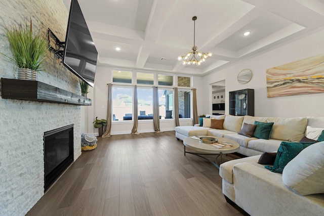 20210 Rolling Vista Dr, Cypress, TX 77433 - living area with coffered ceiling, a chandelier, dark wood finished floors, a large fireplace, and recessed lighting