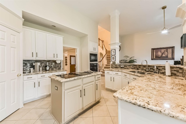 13719 Country Green Ct, Houston, TX 77059 - kitchen featuring black appliances, tasteful backsplash, light tile patterned floors, white cabinetry, and light stone countertops