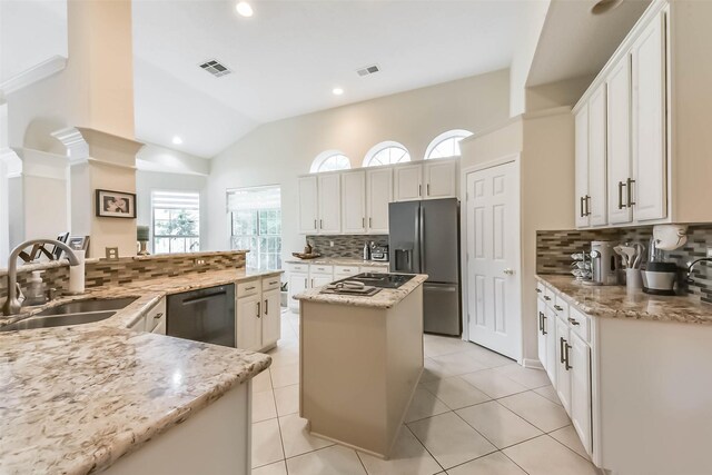 13719 Country Green Ct, Houston, TX 77059 - kitchen with dishwasher, stainless steel fridge with ice dispenser, a center island, tasteful backsplash, and light stone countertops