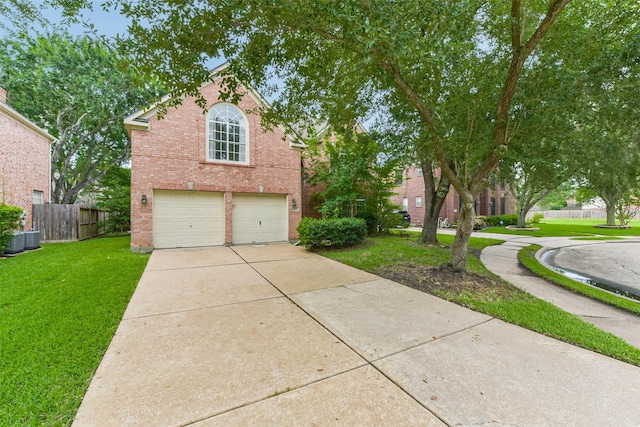 13719 Country Green Ct, Houston, TX 77059 - traditional home featuring a garage, brick siding, and concrete driveway