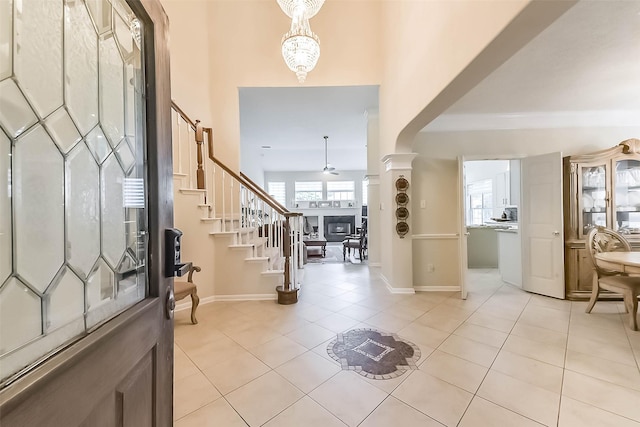 13719 Country Green Ct, Houston, TX 77059 - foyer entrance featuring stairs, light tile patterned flooring, and a fireplace