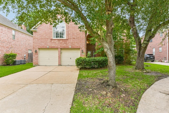 13719 Country Green Ct, Houston, TX 77059 - view of front of house featuring an attached garage, brick siding, driveway, and a front yard