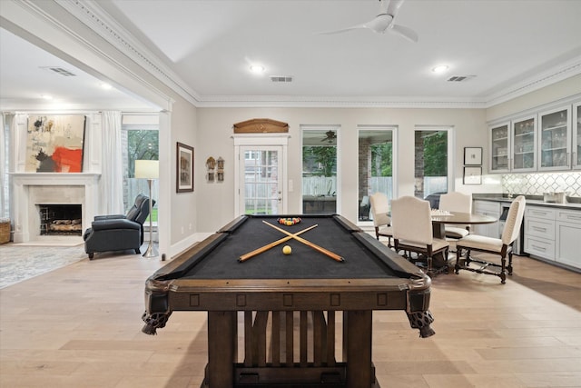 8703 Chelmsford Ln, Spring, TX 77379 - recreation room featuring ceiling fan, light wood finished floors, billiards, plenty of natural light, and ornamental molding