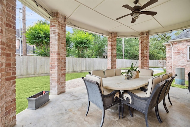 8703 Chelmsford Ln, Spring, TX 77379 - fenced backyard featuring outdoor dining space, ceiling fan, and a patio area