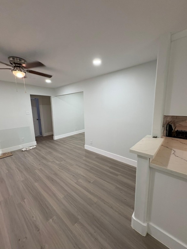 3923 Hickok Ln, Houston, TX 77047 - unfurnished living room featuring wood finished floors, recessed lighting, and ceiling fan