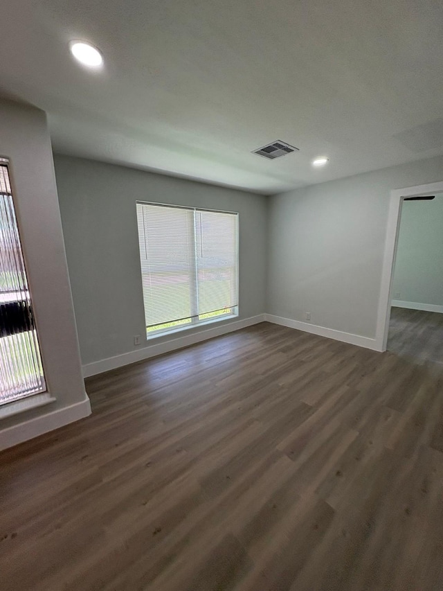 3923 Hickok Ln, Houston, TX 77047 - empty room with dark wood finished floors and recessed lighting