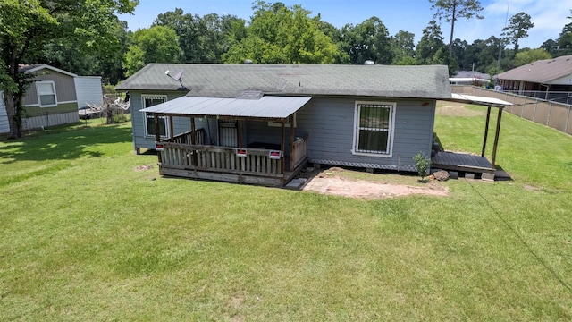 810 W N St, Livingston, TX 77351 - rear view of property with a wooden deck