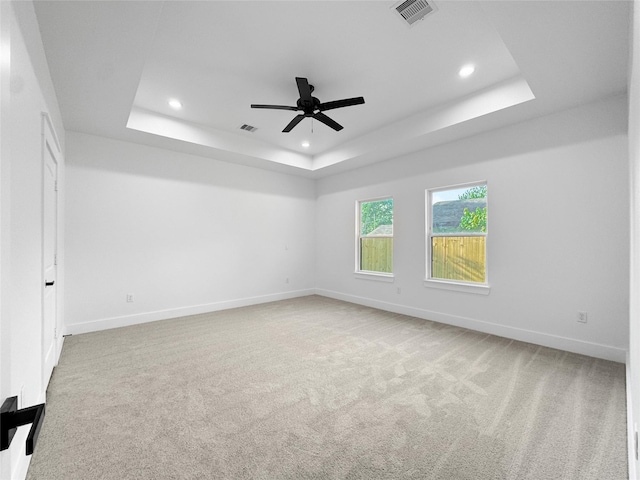 314 E Republic Ave, Baytown, TX 77520 - carpeted empty room with a tray ceiling, recessed lighting, and ceiling fan