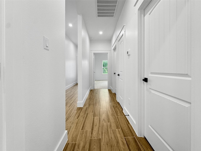 314 E Republic Ave, Baytown, TX 77520 - corridor with dark wood-type flooring and recessed lighting