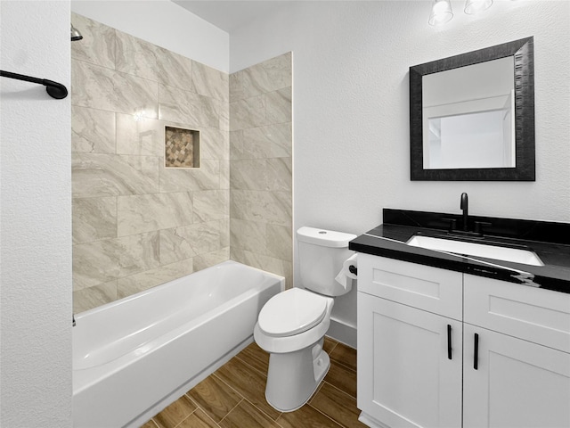 314 E Republic Ave, Baytown, TX 77520 - full bathroom with vanity, wood tiled floors, and shower / washtub combination