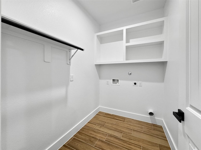 314 E Republic Ave, Baytown, TX 77520 - laundry area with electric dryer hookup, gas dryer hookup, washer hookup, and dark wood-type flooring