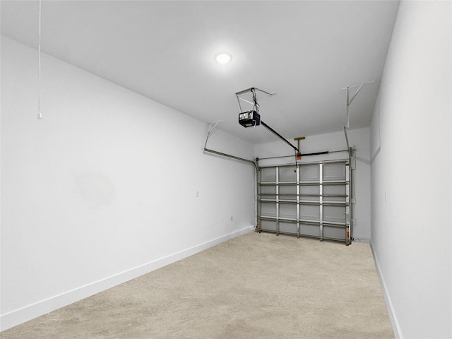 314 E Republic Ave, Baytown, TX 77520 - garage with baseboards and a garage door opener