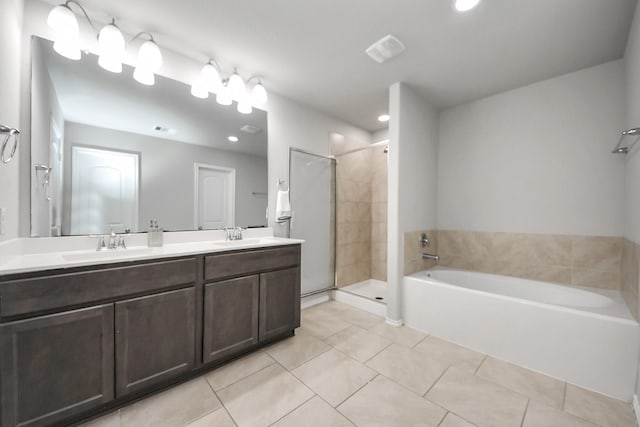 23714 Piedmont Forest Dr, Katy, TX 77493 - full bathroom with tile patterned floors, a garden tub, a stall shower, double vanity, and recessed lighting