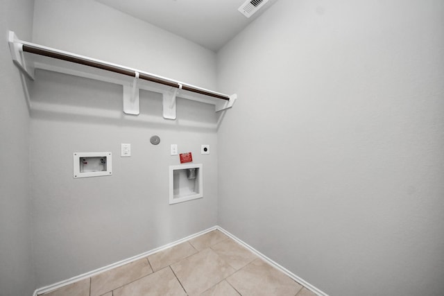 23714 Piedmont Forest Dr, Katy, TX 77493 - laundry room with hookup for an electric dryer, hookup for a washing machine, light tile patterned floors, and hookup for a gas dryer