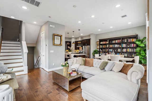 703 Bayou St, Houston, TX 77020 - living area featuring hardwood / wood-style floors, recessed lighting, and stairway