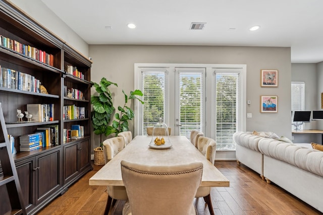 703 Bayou St, Houston, TX 77020 - dining space featuring wood-type flooring, plenty of natural light, and recessed lighting
