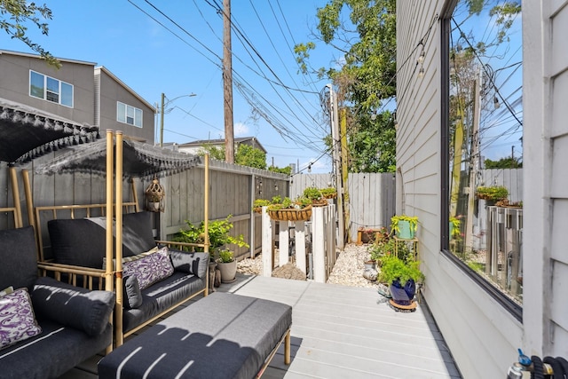 703 Bayou St, Houston, TX 77020 - wooden terrace with outdoor lounge area and a fenced backyard