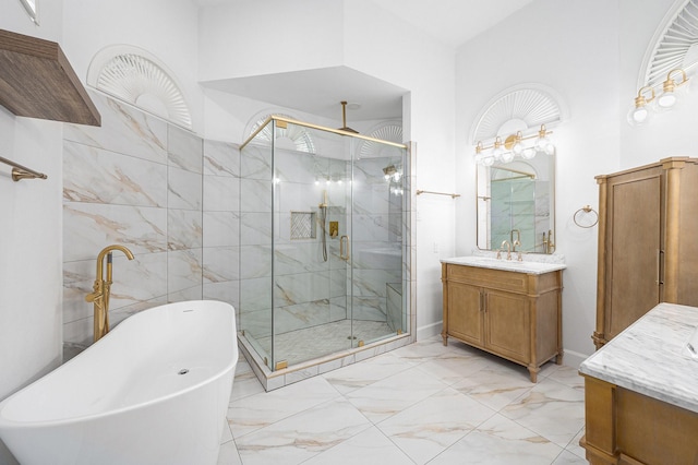 7921 Capri Cir, Houston, TX 77095 - full bathroom with marble finish floors, a shower stall, vanity, and a soaking tub