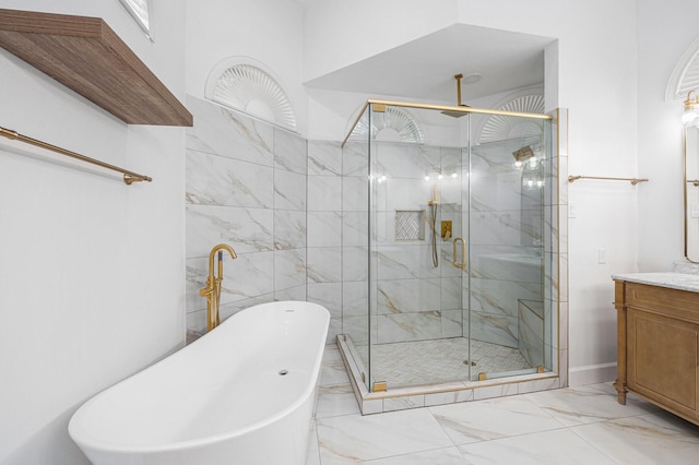 7921 Capri Cir, Houston, TX 77095 - bathroom featuring marble finish flooring, a soaking tub, a stall shower, and vanity