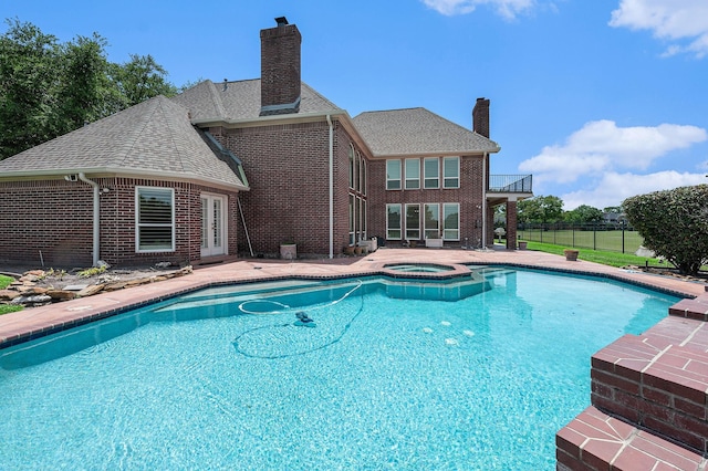 7921 Capri Cir, Houston, TX 77095 - view of swimming pool featuring a pool with connected hot tub and a patio area