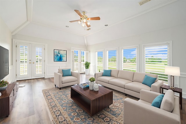 7921 Capri Cir, Houston, TX 77095 - living room featuring lofted ceiling, french doors, plenty of natural light, a ceiling fan, and wood finished floors
