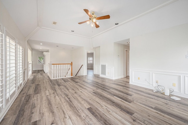 7921 Capri Cir, Houston, TX 77095 - unfurnished room with wood finished floors, ceiling fan, a decorative wall, ornamental molding, and a wainscoted wall