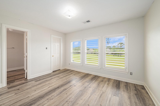 7921 Capri Cir, Houston, TX 77095 - unfurnished room with plenty of natural light and light wood-style flooring