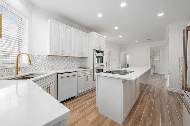 7921 Capri Cir, Houston, TX 77095 - kitchen featuring dishwasher, a kitchen island, double oven, black electric stovetop, and tasteful backsplash
