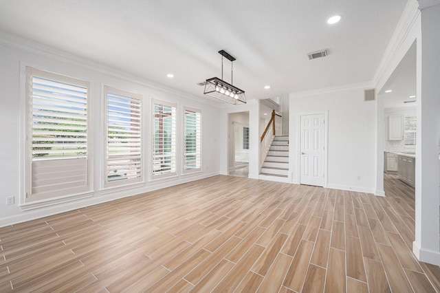 7921 Capri Cir, Houston, TX 77095 - unfurnished living room with ornamental molding, plenty of natural light, stairs, light wood-type flooring, and recessed lighting