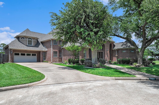7921 Capri Cir, Houston, TX 77095 - view of front of home with brick siding, a front lawn, driveway, and roof with shingles