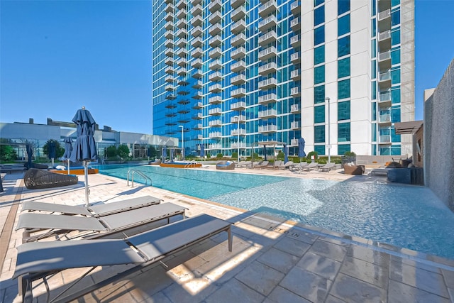 5925 Almeda Rd Unit 11608, Houston, TX 77004 - community pool featuring a patio